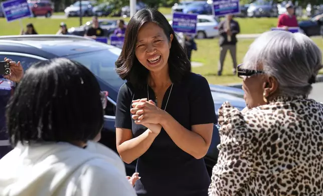 Boston Mayor Michelle Wu chats with voters at a polling place, Tuesday, Sept. 9, 2025, in the Dorchester neighborhood of Boston. (AP Photo/Charles Krupa)