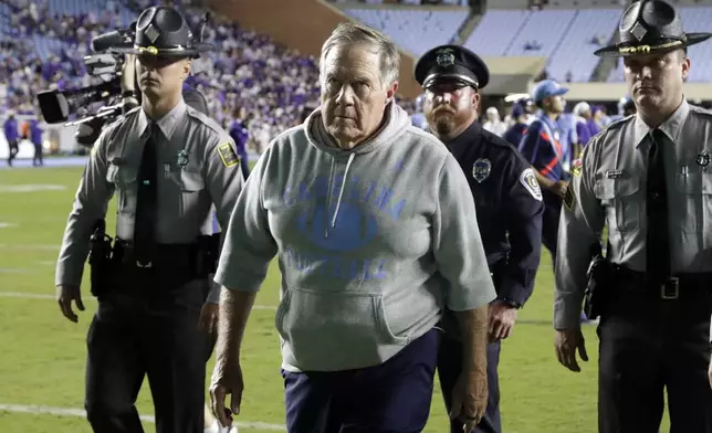 North Carolina head coach Bill Belichick, front, walks off the field after his team lost to TCU in an NCAA college football game Monday, Sept. 1, 2025, in Chapel Hill, N.C. (AP Photo/Chris Seward)