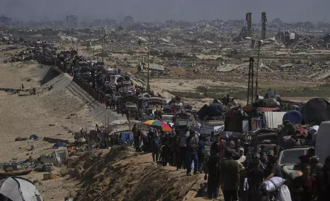 Displaced Palestinians flee northern Gaza along the coastal road toward the south, after Israel's military says its expanded operation in Gaza City has begun and warns residents to leave, Tuesday, Sept. 16, 2025. (AP Photo/Abdel Kareem Hana)