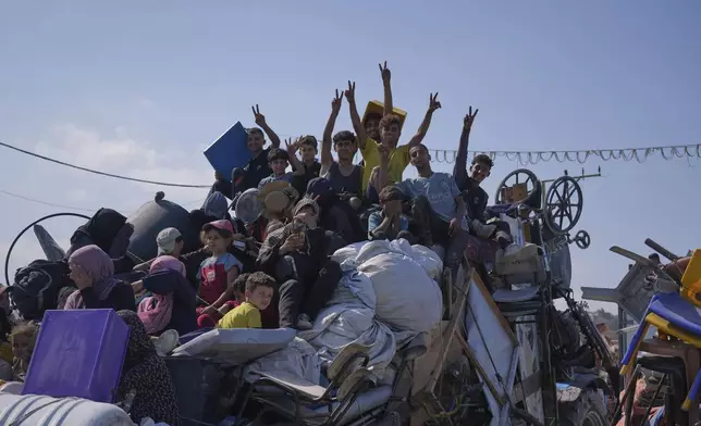 Displaced Palestinians flee northern Gaza along the coastal road toward the south, as Israel announced an expanded operation in Gaza City, Tuesday, Sept. 16, 2025. (AP Photo/Abdel Kareem Hana)