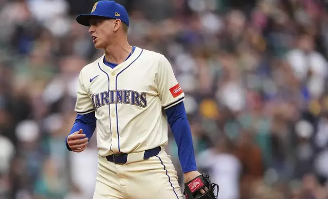 Seattle Mariners relief pitcher Casey Legumina reacts to a win over the Los Angeles Angels in a baseball game Sunday, Sept. 14, 2025, in Seattle. (AP Photo/Lindsey Wasson)