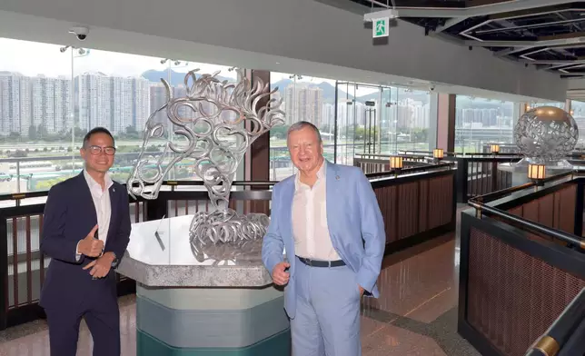 Such artistry: Horseshoes and farriers are key to Hong Kong racing. The Hong Kong Jockey Club’s Chief Executive Officer Winfried Engelbrecht-Bresges (right) and Executive Director, Customer Strategy, Insights and Innovation Dennis Hau pose in front of horseshoe sculptures by the Club’s farriers in Gensō Eki.