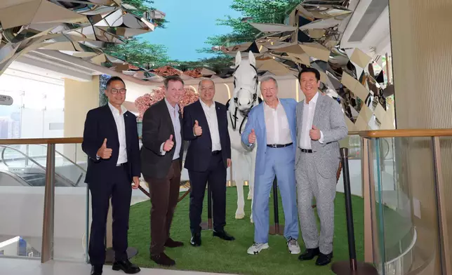 Saying hello to a lifelike steed: (from left to right) The Hong Kong Jockey Club Executive Director, Customer Strategy, Insights and Innovation Dennis Hau; Executive Director, Racing Andrew Harding; Executive Director, Corporate Affairs Raymond Tam; Chief Executive Officer Winfried Engelbrecht-Bresges; and Director of Property Philip Chen stand with the Champions Connection robotic horse for a Instagrammable moment.