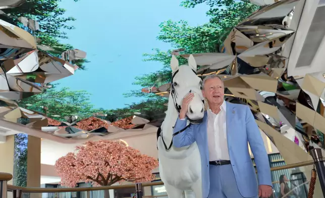 Saying hello to a lifelike steed: (from left to right) The Hong Kong Jockey Club Executive Director, Customer Strategy, Insights and Innovation Dennis Hau; Executive Director, Racing Andrew Harding; Executive Director, Corporate Affairs Raymond Tam; Chief Executive Officer Winfried Engelbrecht-Bresges; and Director of Property Philip Chen stand with the Champions Connection robotic horse for a Instagrammable moment.