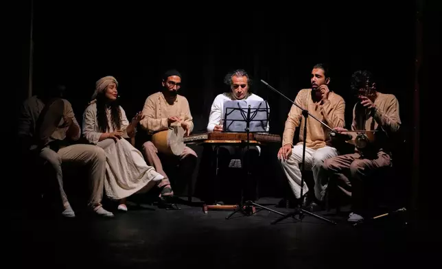 The music band performs during a musical play "Mehrara", a love story which takes place in Qajar dynasty era, directed by Daniyal Ghafari, at Neauphle-le-Château theater hall, in Tehran, Iran, Wednesday, Sept. 3, 2025. (AP Photo/Vahid Salemi)