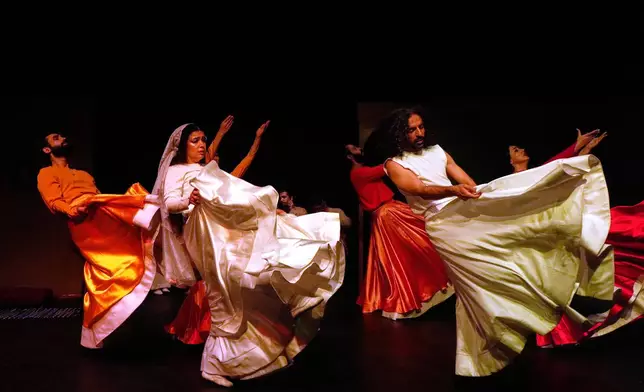Iranian actors Jeyran Barikani, second left, Kamal Razavi, right, and others dance during a musical play "Mehrara," a love story which takes place in Qajar dynasty era, directed by Daniyal Ghafari, at Neauphle-le-Château theater hall, in Tehran, Iran, Wednesday, Sept. 3, 2025. (AP Photo/Vahid Salemi)