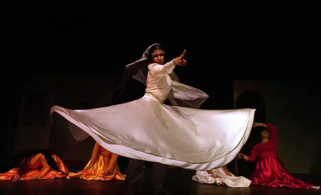 Iranian actress Jeyran Barikani dances during a musical play "Mehrara", a love story which takes place in Qajar dynasty era, directed by Daniyal Ghafari, at Neauphle-le-Château theater hall, in Tehran, Iran, Wednesday, Sept. 3, 2025. (AP Photo/Vahid Salemi)