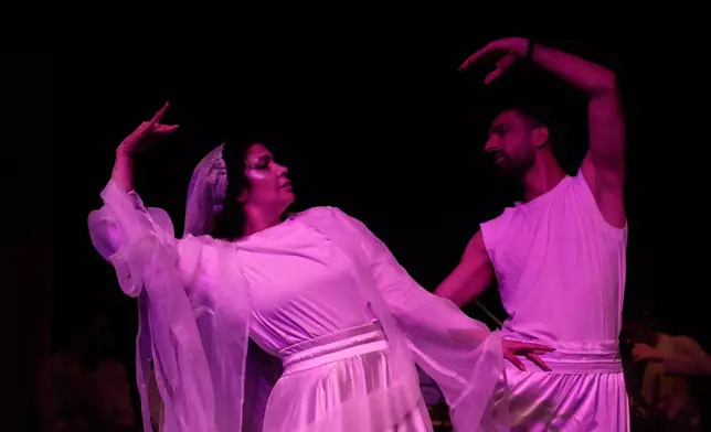 Iranian actors Jeyran Barikani, left, and Kamal Razavi dance during a musical play "Mehrara," a love story which takes place in Qajar dynasty era, directed by Daniyal Ghafari, at Neauphle-le-Château theater hall, in Tehran, Iran, Wednesday, Sept. 3, 2025. (AP Photo/Vahid Salemi)