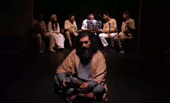 Iranian actor Reza Jahangiri plays during a musical play "Mehrara", a love story which takes place in Qajar dynasty era, directed by Daniyal Ghafari, at Neauphle-le-Chateau theater hall, in Tehran, Iran, Wednesday, Sept. 3, 2025. (AP Photo/Vahid Salemi)