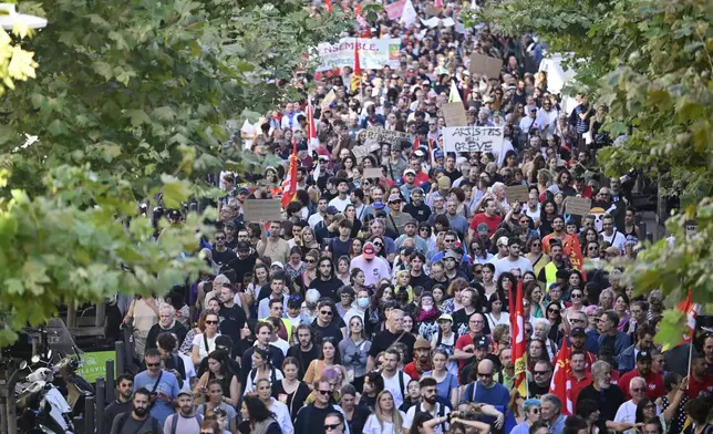 FILE- Protesters march during a rally of the "Block Everything" movement in Marseille, south of France, Wednesday, Sept. 10, 2025. (AP Photo/Philippe Magoni, File)