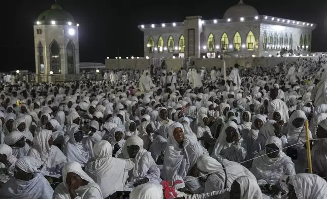 Worshippers gather to mark Prophet Muhammad's birthday, known as Mawlid, in Dakar, Senegal, Thursday, Sept 4, 2025. (AP Photo/Misper Apawu)