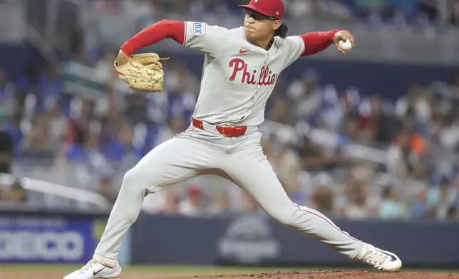 Philadelphia Phillies starting pitcher Jesús Luzardo aims a pitch during the first inning of a baseball game against the Miami Marlins Saturday, Sept. 6, 2025, in Miami. (AP Photo/Marta Lavandier)