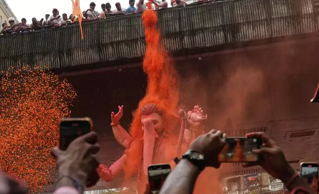 An idol of elephant-headed Hindu god Ganesha is taken for immersion on the final day of the ten-day long Ganesh Chaturthi festival in Mumbai, India, Saturday, Sept. 6, 2025. (AP Photo/Rajanish Kakade)