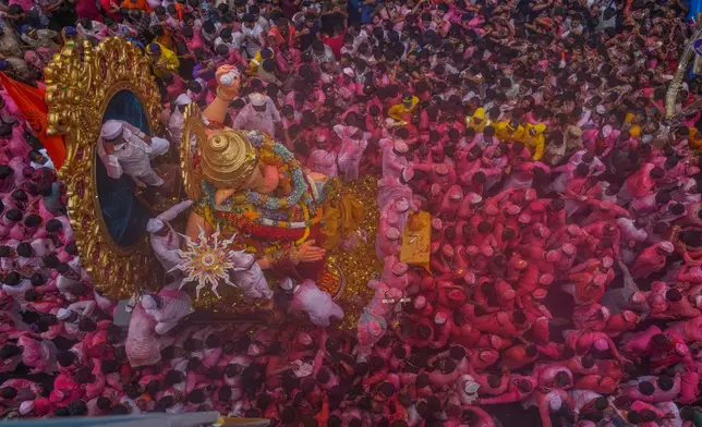 An idol of elephant-headed Hindu god Ganesha is taken for immersion on the final day of the ten-day long Ganesh Chaturthi festival in Mumbai, India, Saturday, Sept. 6, 2025. (AP Photo/Rafiq Maqbool)