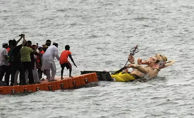 Idols of elephant-headed Hindu god Ganesha is immersed at Arabian Sea on the final day of the ten-day long Ganesh Chaturthi festival in Mumbai, India, Saturday, Sept. 6, 2025. (AP Photo/Rajanish Kakade)