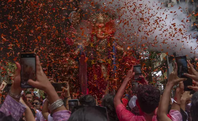 An idol of elephant-headed Hindu god Ganesha is taken for immersion on the final day of the ten-day long Ganesh Chaturthi festival in Mumbai, India, Saturday, Sept. 6, 2025. (AP Photo/Rafiq Maqbool)