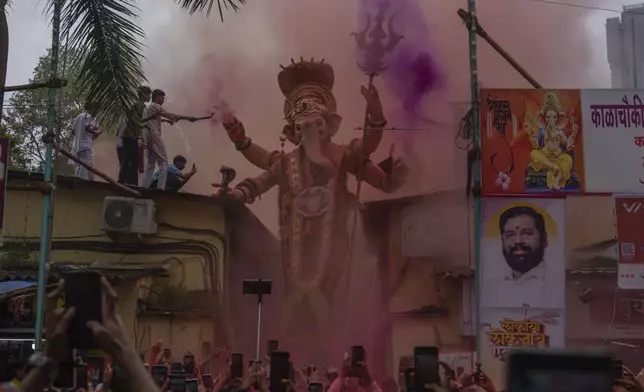 An idol of elephant-headed Hindu god Ganesha is taken for immersion on the final day of the ten-day long Ganesh Chaturthi festival in Mumbai, India, Saturday, Sept. 6, 2025. (AP Photo/Rafiq Maqbool)