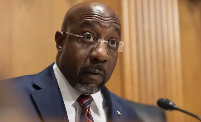 Sen. Raphael Warnock, D-Ga., speaks as Secretary of Health and Human Services Robert F. Kennedy Jr., appears before the Senate Finance Committee, on Capitol Hill in Washington, Thursday, Sept. 4, 2025. (AP Photo/Mark Schiefelbein)