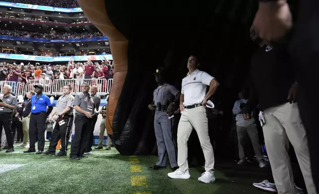 South Carolina head coach Shane Beamer looks out to the crowd before an NCAA college football game against Virginia Tech, Sunday, Aug. 31, 2025, in Atlanta. (AP Photo/Brynn Anderson)