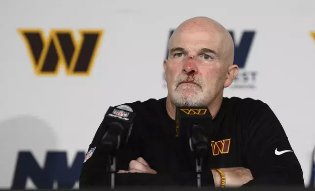 Washington Commanders Dan Quinn speaks during a news conference after an NFL football game against the Las Vegas Raiders, Sunday, Sept. 21, 2025, in Landover, Md. (AP Photo/Nick Wass)