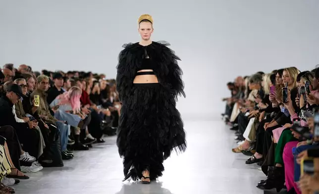 A model wears a creation part of the Max Mara women's Spring-Summer 2026 collection, presented in Milan, Italy, Thursday, Sept. 25, 2025. (AP Photo/Luca Bruno)