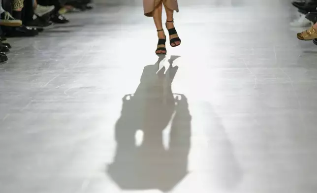 A model wears a creation part of the Max Mara women's Spring-Summer 2026 collection, presented in Milan, Italy, Thursday, Sept. 25, 2025. (AP Photo/Luca Bruno)