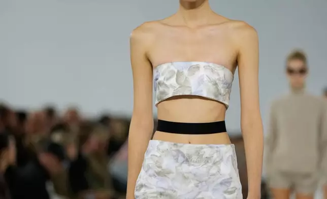 A model wears a creation part of the Max Mara women's Spring-Summer 2026 collection, presented in Milan, Italy, Thursday, Sept. 25, 2025. (AP Photo/Luca Bruno)