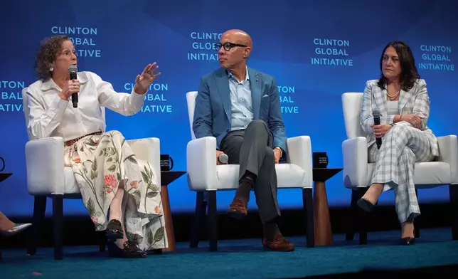 American film producer and philanthropist, Abigail Disney, left, speaks next to Darren Walker, President, Ford Foundation, center, and Maribel Perez Wadsworth, during the Clinton Global Initiative, on Wednesday, Sept. 24, 2025, in New York. (AP Photo/Andres Kudacki)