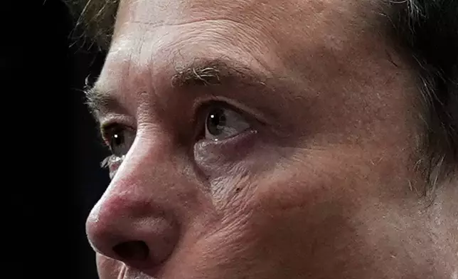 FILE - Elon Musk attends a memorial for conservative activist Charlie Kirk, Sunday, Sept. 21, 2025, at State Farm Stadium in Glendale, Ariz. (AP Photo/Julia Demaree Nikhinson)