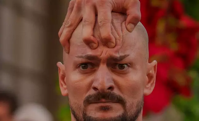 FILE - Artists of the Bucharest Metropolitan Circus perform during an event marking the day when the Romanian capital was first mentioned in historical records, 566 years ago, in Bucharest, Romania, Saturday, Sept. 20, 2025. (AP Photo/Vadim Ghirda)