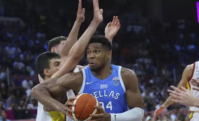 Greece's Giannis Antetokounmpo drives the ball during the Eurobasket, European Basketball Championship Group C match between Spain and Greece at Spyros Kyprianou Arena, in Limassol, Cyprus, Thursday, Sept. 4, 2025. (AP Photo/Sakis Savvides)