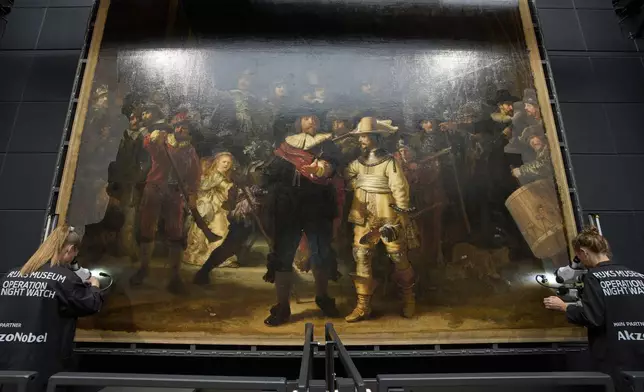 Art restorers work on Rembrandt's Night Watch at Amsterdam's Rijksmuseum, Netherlands, Tuesday, Sept. 23, 2025. (AP Photo/Peter Dejong)
