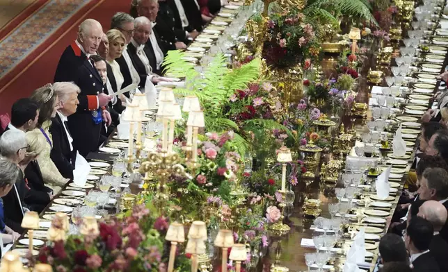 Britain's King Charles III, center left, speaks at a State Banquet during a State visit of President Donald Trump at Windsor Castle in Windsor, England, Wednesday, Sept. 17, 2025. (AP Photo/Evan Vucci, Pool)