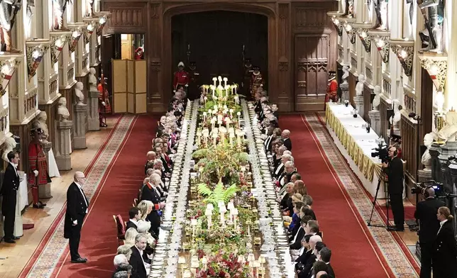 Guests attend a State Banquet during a State visit of President Donald Trump at Windsor Castle in Windsor, England, Wednesday, Sept. 17, 2025. (AP Photo/Evan Vucci, Pool)