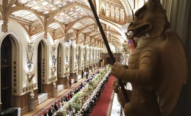 Guests attend a State Banquet during a State visit of President Donald Trump at Windsor Castle in Windsor, England, Wednesday, Sept. 17, 2025. (AP Photo/Evan Vucci, Pool)