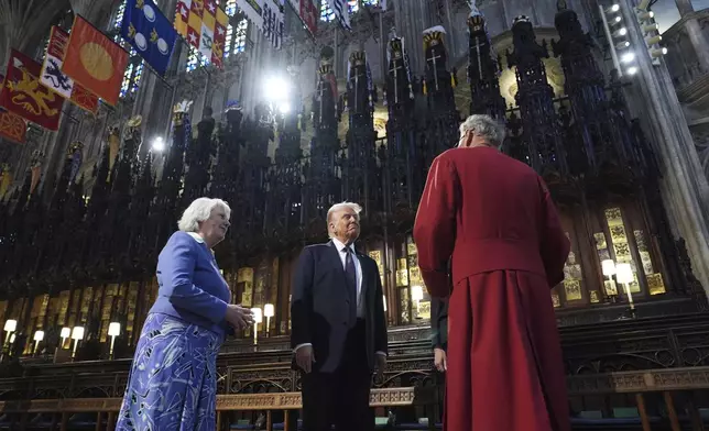 President Donald Trump and first lady Melania Trump receive a tour of St. George's Chapel at Windsor Castle, Windsor, England, Wednesday, Sept. 17, 2025. (AP Photo/Evan Vucci, Pool)