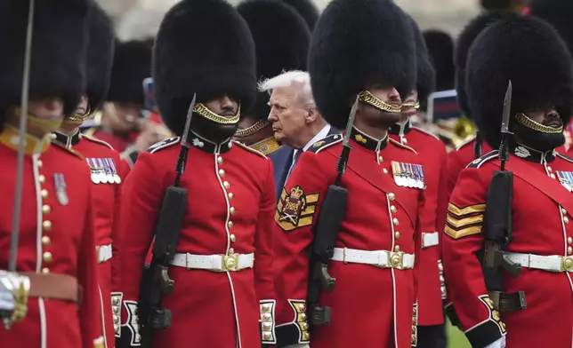 President Donald Trump reviews the guard of honour during the ceremonial welcome at Windsor Castle, England, Wednesday, Sept. 17, 2025. (Jonathan Brady/Pool Photo via AP)