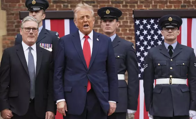President Donald Trump reacts next to Britain's Prime Minister Keir Starmer upon arriving at Chequers near Aylesbury, England, Thursday, Sept. 18, 2025. (AP Photo/Evan Vucci)