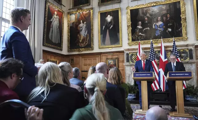President Donald Trump gestures next to Britain's Prime Minister Keir Starmer during a joint press conference at Chequers near Aylesbury, England, Thursday, Sept. 18, 2025. (AP Photo/Evan Vucci)