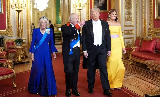 U.S. President Donald Trump and First Lady Melania Trump, right, arrive with Britain's King Charles and Britain's Queen Camilla, for the official state banquet at the Windsor Castle, in Windsor, England, Wednesday, Sept. 17, 2025. (Doug Mills/The New York Times via AP, Pool)