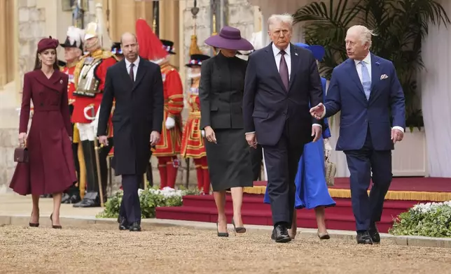 From left, Britain's Kate, Princess of Wales, Britain's Prince William, President Donald Trump and first lady Melania Trump, Britain's King Charles III and Britain's Queen Camilla walk during arrival ceremony at Windsor Castle, in Windsor, England, Wednesday, Sept. 17, 2025. (AP Photo/Evan Vucci)
