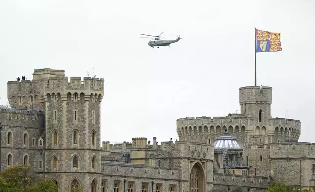 A helicopter believed to have President Donald Trump and first lady Melania Trump on board approaches landing at Windsor Castle in Windsor, England, Wednesday, Sept. 17, 2025.(AP Photo/Alastair Grant)