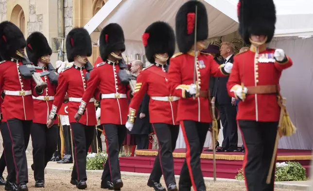 President Donald Trump and first lady Melania Trump watch as regiments pass by during an arrival ceremony at Windsor Castle, in Windsor, England, Wednesday, Sept. 17, 2025. (AP Photo/Evan Vucci)