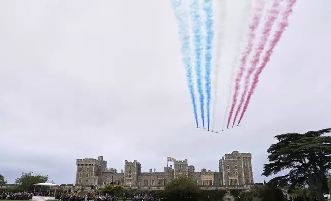 The Red Arrows fly in formation over Windsor Castle during the State visit of President Donald Trump and first lady Melania Trump in Windsor, England, Wednesday, Sept. 17, 2025. (AP Photo/Evan Vucci)