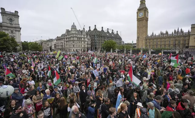 Protesters meet in Parliament Square during a demonstration of the Stop Trump Coalition group against President Donald Trump's state visit in London, Wednesday, Sept. 17, 2025.(AP Photo/Kin Cheung)