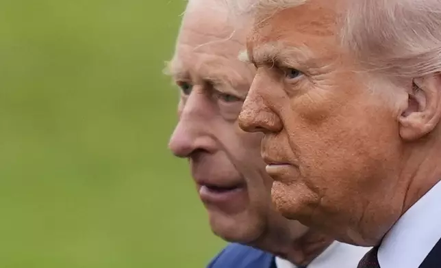 King Charles III, left, and President Donald Trump, left, during a Beating Retreat ceremony at Windsor Castle, England, Wednesday, Sept. 17, 2025. (Jordan Pettitt/Pool Photo via AP)
