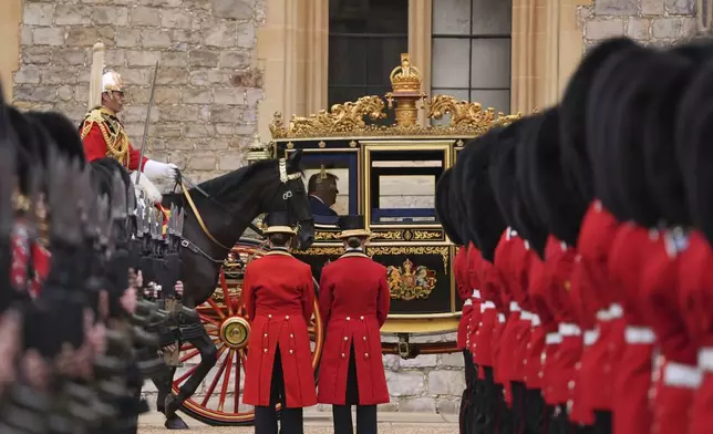 President Donald Trump and Britain's King Charles III arrive in the Irish State Coach during an arrival ceremony at Windsor Castle, in Windsor, England, Wednesday, Sept. 17, 2025. (AP Photo/Evan Vucci)