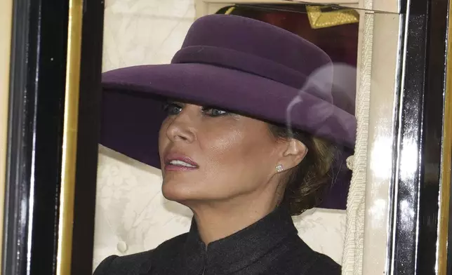 First Lady Melania Trump rides in a carriage procession with Britain's Queen Camilla to Windsor Castle, England, Wednesday, Sept. 17, 2025. (Jordan Pettitt/Pool Photo via AP)
