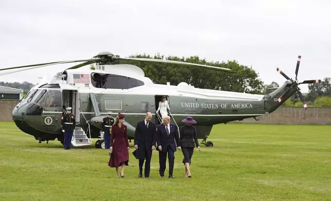 Britain's Prince William and Kate, Princess of Wales, left, receive President Donald Trump and first lady Melania Trump at Windsor Castle in Windsor, England, Wednesday Sept. 17, 2025. (Aaron Chown/Pool Photo via AP)