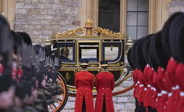President Donald Trump and Britain's King Charles III arrive in the Irish State Coach during an arrival ceremony at Windsor Castle, in Windsor, England, Wednesday, Sept. 17, 2025. (AP Photo/Evan Vucci)